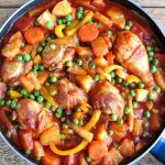 chicken afritada with carrots, pineapples, green peas