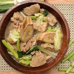 top view of nilagang baboy with saba banana and pechay, green beans and cabbage