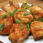 korean fried chicken sprinkle with scallions on top.