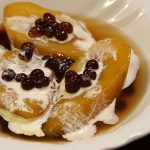 minatamis na saging in a bowl top with sago with milk