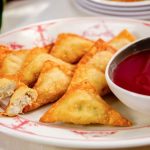 delicious crab rangoon in a plate with sauce