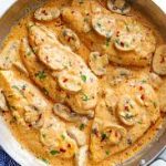creamy garlic parmesan chicken with mushroom in a large skillet