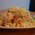 yang chow on a plate with spoon