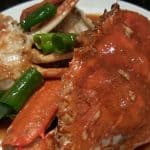 chili crab with snake beans on a plate